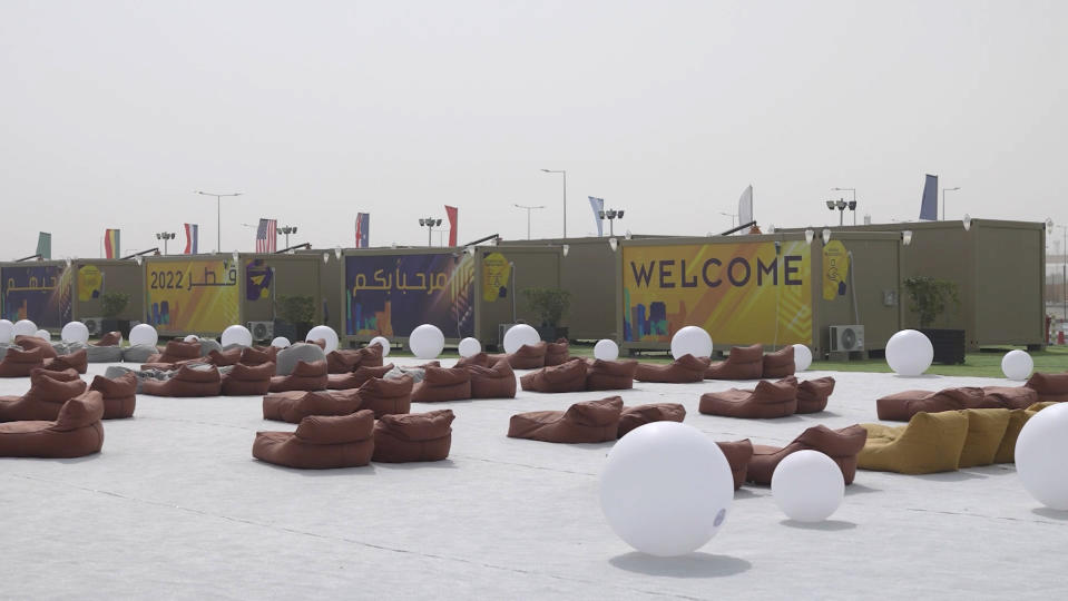 In this photo taken from video, a view of large bean-bag style chairs are seen in front of accommodation cabins in the fan village in Doha, Qatar, Wednesday, Nov. 9, 2022. Qatar on Wednesday unveiled a 6,000-cabin fan village in an isolated lot near its international airport, an offering for housing toward the lower end of what's available for the upcoming World Cup just days away from starting. (AP Photo/Lujain Jo)