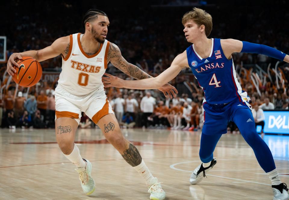 Texas forward Timmy Allen, left, defends against Kansas guard Gradey Dick during the first half of the Longhorns' win over Kansas on Saturday at Moody Center. Allen earned honorable mention Big 12 honors after scoring 10.8 points a game and leading Texas with 5.5 rebounds.