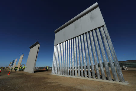 Seven of U.S. President Donald Trump's eight border wall prototypes are shown near completion along U.S.- Mexico border near San Diego, California, U.S., October 23, 2017. REUTERS/Mike Blake