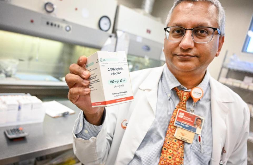 Dr. Ravi Rao holds up a cancer drug at California Cancer Associates for Research and Excellence in Fresno on Wednesday, July 5, 2023. Dr. Rao has been frustrated about the shortage of cancer drugs for treating his patients.