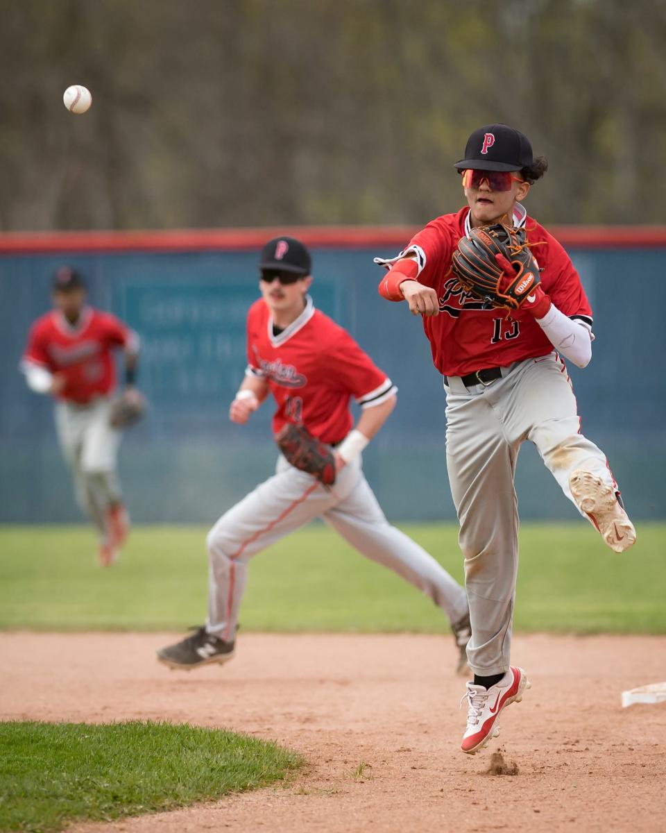 Proctor's Keyther Carrasco throws the ball to first base at New Hartford High School Tuesday.