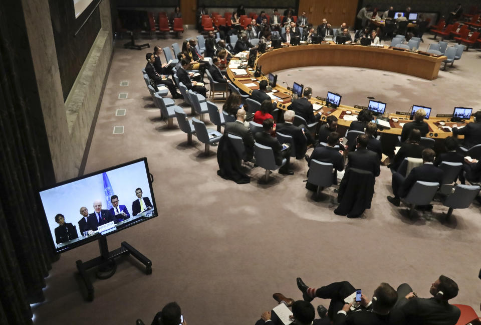 United Nations chief mediator for Syria, Staffan de Mistura, shown center in a live video broadcast, briefs the U.N. Security Council, Monday, Nov. 19, 2018 at U.N. headquarters. (AP Photo/Bebeto Matthews)