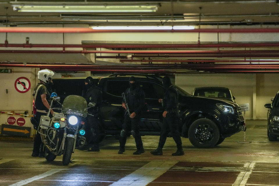 Police's anti-terrorism division stand in a parking area of the court house as they prepare to leave with the fugitive deputy leader of Greece's extreme right-wing Golden Dawn party Christos Pappas, in Athens, Friday, July 2, 2021. Pappas, a 59-year-old former lawmaker, has been jailed hours after his capture. He had been on the run for nearly nine months, disappearing before a court sentenced him to 13 years for participation in a criminal organization. (AP Photo/Petros Giannakouris)