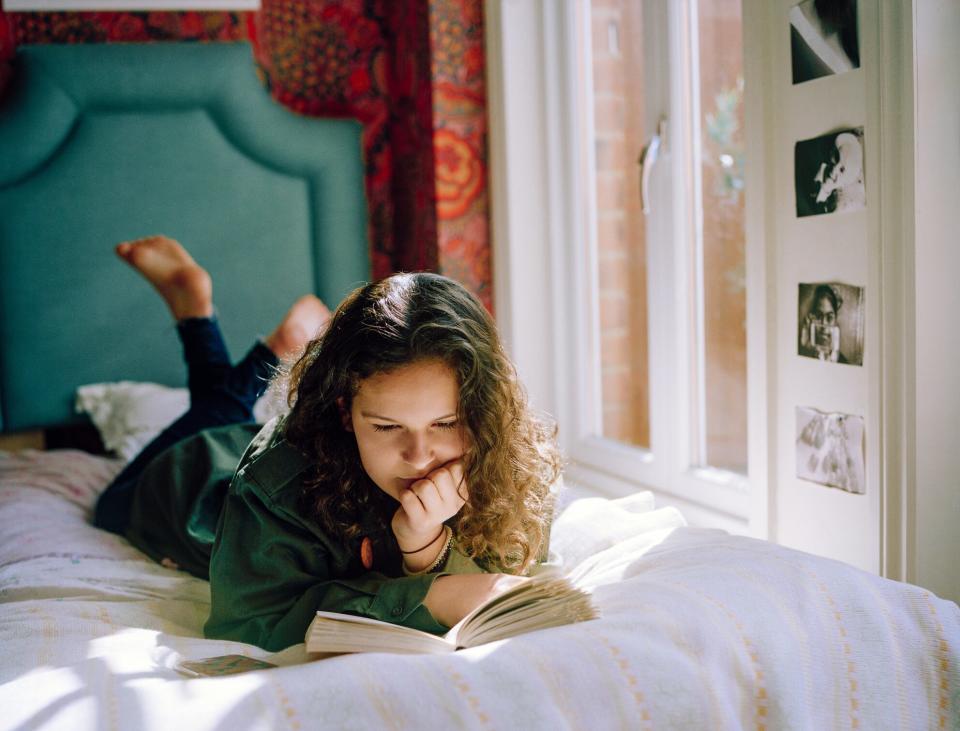 An image of a teen reading.