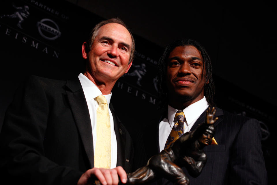 NEW YORK, NY - DECEMBER 10: (L-R) Coach Art Briles and Robert Griffin III of the Baylor Bears poses with the trophy after being named the 77th Heisman Memorial Trophy Award winner during a press conference at The New York Marriott Marquis on December 10, 2011 in New York City. (Photo by Jeff Zelevansky/Getty Images)