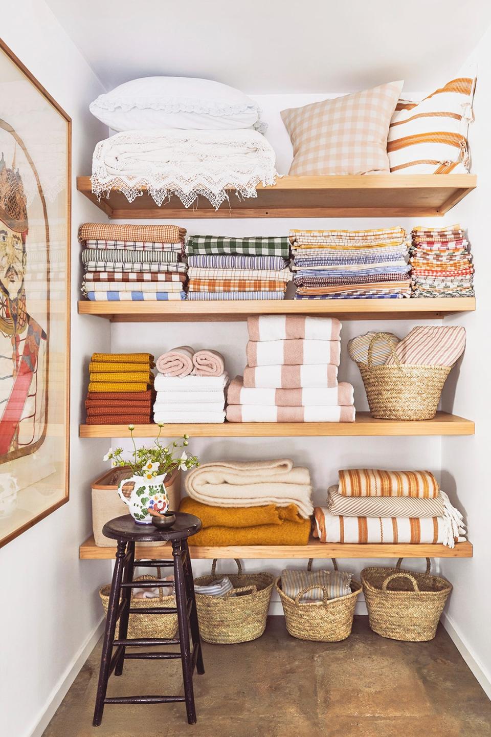 towels stacked in linen closet