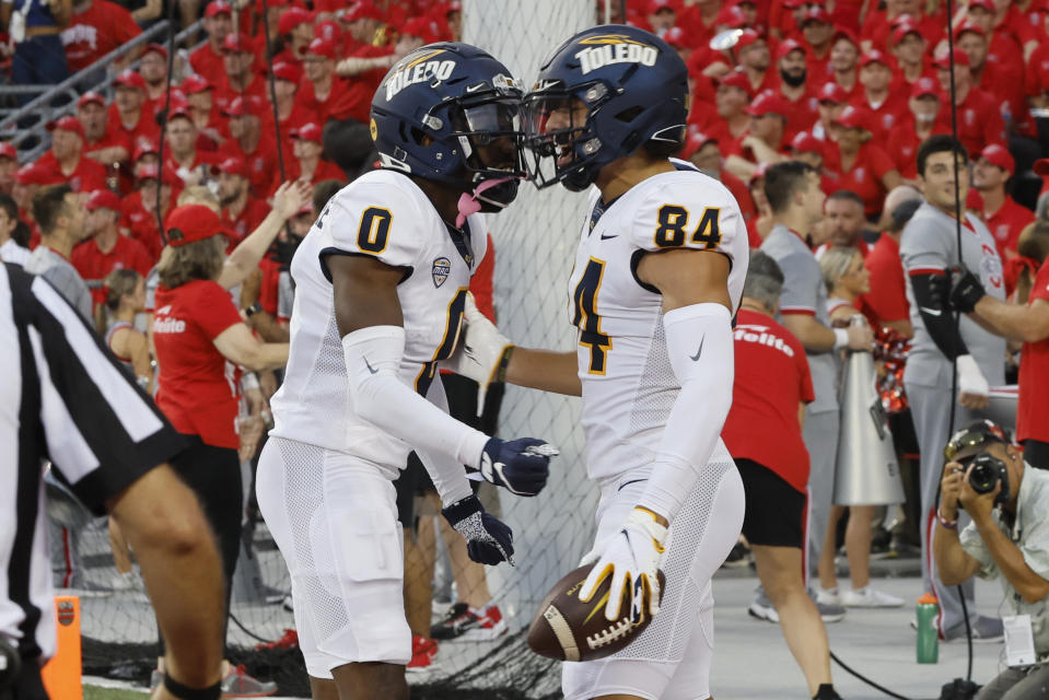 Toledo receiver Thomas Zsiros, right, celebrates his touchdown against Ohio State with receiver DeMeer Blankumsee during the first half of an NCAA college football game Saturday, Sept. 17, 2022, in Columbus, Ohio. (AP Photo/Jay LaPrete)