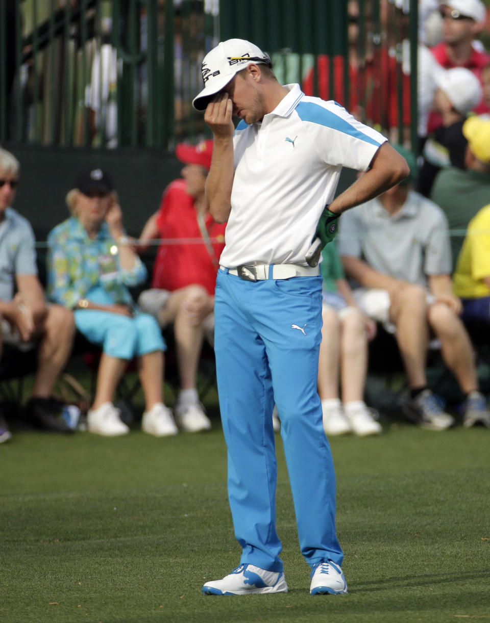 Jonas Blixt, of Sweden, reacts after his putt on the 15th green during the fourth round of the Masters golf tournament Sunday, April 13, 2014, in Augusta, Ga. (AP Photo/Charlie Riedel)