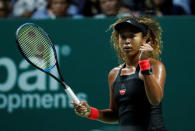 Tennis - WTA Tour Finals - Singapore Indoor Stadium, Kallang, Singapore - October 22, 2018 Japan's Naomi Osaka celebrates during her group stage match against Sloane Stephens of the U.S. REUTERS/Edgar Su