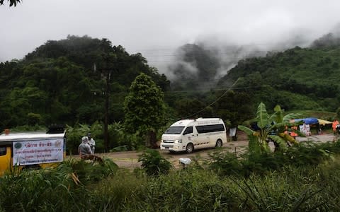 An ambulance leaves the Tham Luang cave area as rescue operations continue for those still trapped inside the cave in Khun Nam Nang Non Forest Park - Credit: Ye Aung Thu/AFP