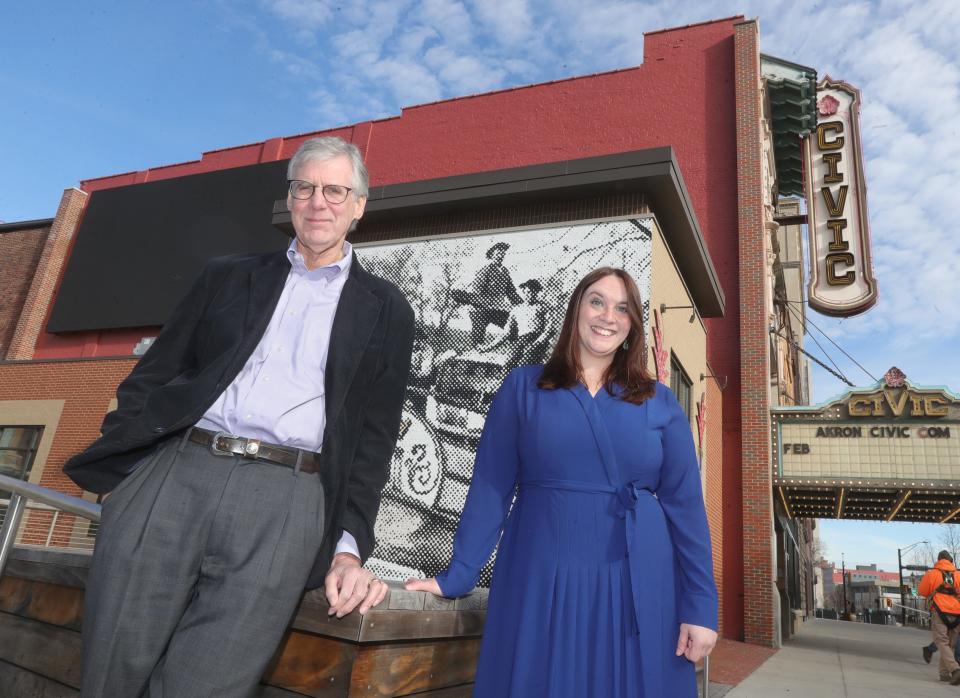 Development Finance Authority of Summit County President Chris Burnham and Vice President Rachel Bridenstine outside the Akron Civic Theatre.