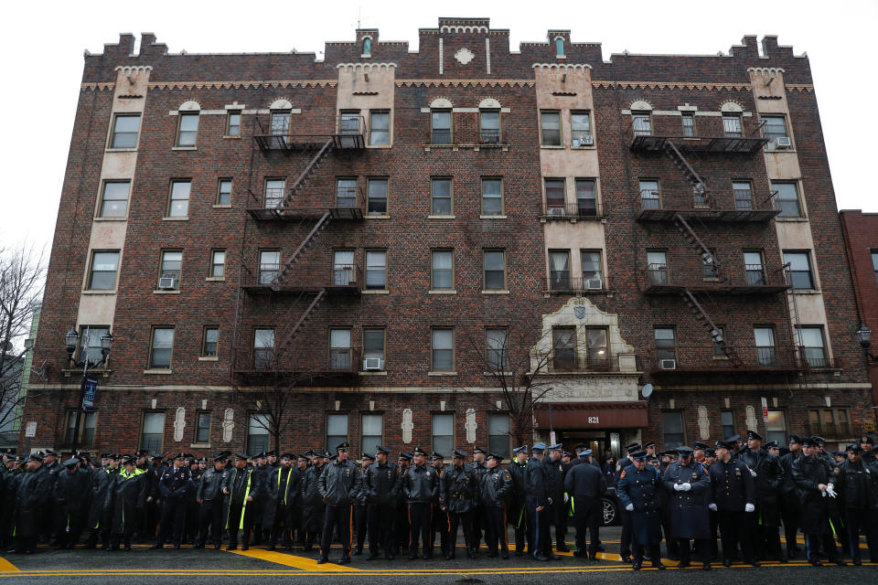 Police officers and other first responders gather before the funeral of Jersey City Police Detective Joseph Seals in Jersey City, N.J., Tuesday, Dec. 17, 2019. Funeral services for Seals are scheduled for Tuesday morning. The 40-year-old married father of five was killed in a confrontation a week ago with two attackers who then drove to a kosher market and killed three people inside before dying in a lengthy shootout with police. (AP Photo/Seth Wenig)