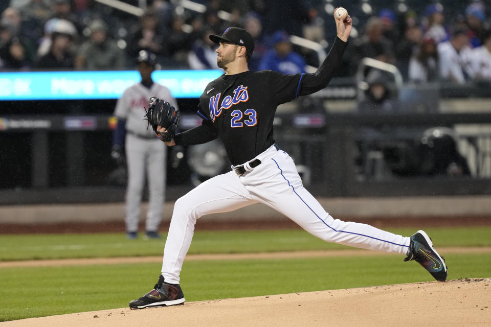 New York Mets starting pitcher David Peterson throws during the first inning of the team's baseball game against the Atlanta Braves, Friday, April 28, 2023, in New York. (AP Photo/Bryan Woolston)