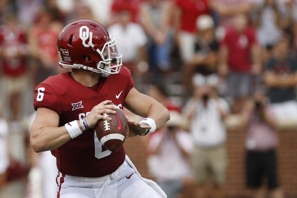 Oklahoma quarterback Baker Mayfield (6) looks for a receiver before throwing a touchdown pass against Tulane during the first quarter of an NCAA college football game in Norman, Okla., Saturday, Sept. 16, 2017. (AP Photo/Mitch Alcala)