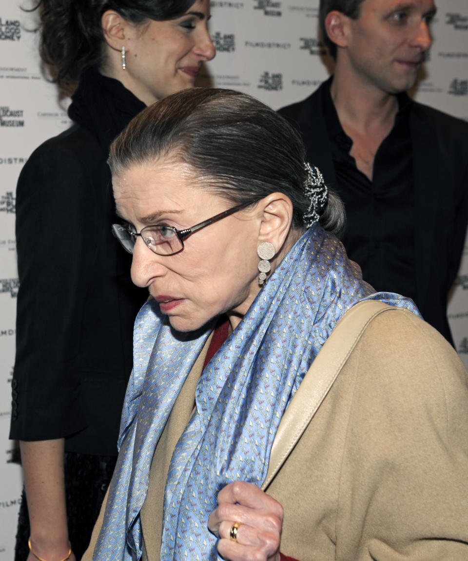 FILE - Supreme Court Justine Ruth Bader Ginsburg arrives for the premiere of Angelina Jolie's movie "In the Land of Blood and Honey" at the Holocaust Memorial Museum in Washington, Jan. 10, 2012. A collection of nearly 100 items is being sold in an online auction that begins Wednesday, Sept. 7, 2022, and runs through Sept. 16. It concludes just before the two-year anniversary of Ginsburg's death at 87. The proceeds will benefit SOS Children’s Villages, an organization that supports vulnerable children around the world. (AP Photo/Cliff Owen, File)