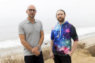 Author Neil Strauss, left, and Incubus guitarist Mike Einziger, of the podcast "To Live and Die in LA," pose for a portrait on Thursday, June 17, 2021, in Malibu, Calif. Strauss is back with a second season of his podcast, focusing on the 2017 disappearance of Elaine Park, a 20-year-old woman last seen in Calabasas, California. (Photo by Willy Sanjuan/Invision/AP)