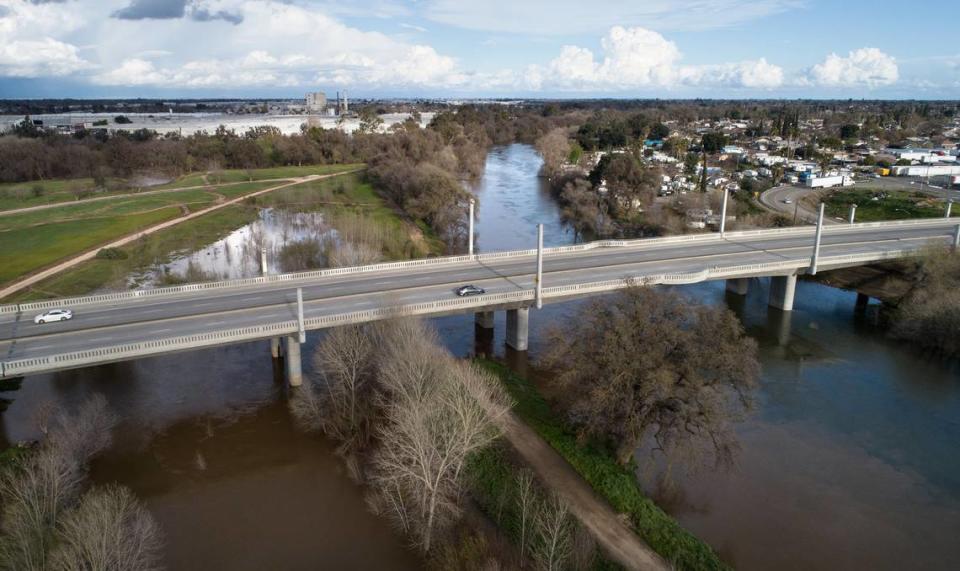 The Tuolumne River at the 9th Street Bridge in Modesto, Calif., Saturday afternoon, March 11, 2023. The river is in the monitoring stage, at 51.9 feet Sunday morning, down from reaching 52.3 feet overnight.