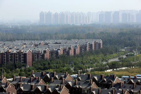 Apartment blocks and villas (bottom) are pictured in Wuqing District of Tianjin, China September 10, 2016. Picture taken September 10, 2016. REUTERS/Jason Lee