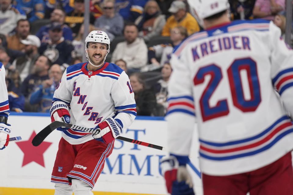 New York Rangers' Vincent Trocheck, left, celebrates after scoring during the third period of an NHL hockey game against the St. Louis Blues Thursday, Jan. 11, 2024, in St. Louis. (AP Photo/Jeff Roberson)