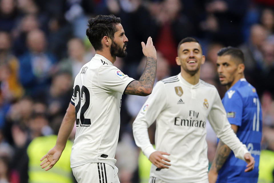 Real Madrid's Isco, left celebrates after scoring his side's fourth goal during a round of 32, 2nd leg, Spanish Copa del Rey soccer match between Real Madrid and Melilla at the Santiago Bernabeu stadium in Madrid, Spain, Thursday, Dec. 6, 2018. (AP Photo/Paul White)