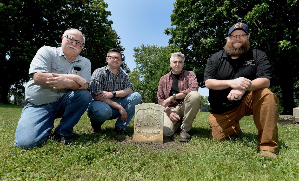 Floyd Mansberger, Paul Golladay, Christopher Stratton and Adam Krall, l-r, gather at the tombstone of Silas Sappington in Oak Ridge Cemetery on Wednesday, May 25, 2023. The four are working on restoring the federal marker in time for Memorial Day. Sappington served as corporal in the 55th Massachusetts Volunteer Infantry during the Civil War. He moved to Springfield after the Civil War and died in 1922. The marker for Sappington was erected in 1925.