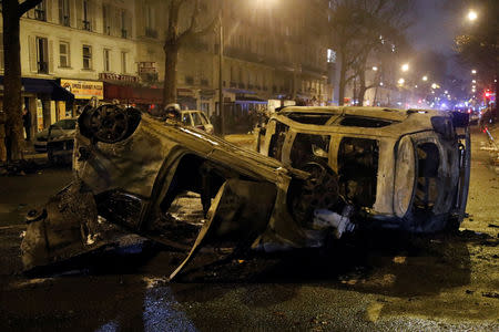 Burned cars are seen on avenue Kleber after clashes with protesters wearing yellow vests, a symbol of a French drivers' protest against higher diesel taxes, in Paris, France, December 1, 2018. REUTERS/Charles Platiau