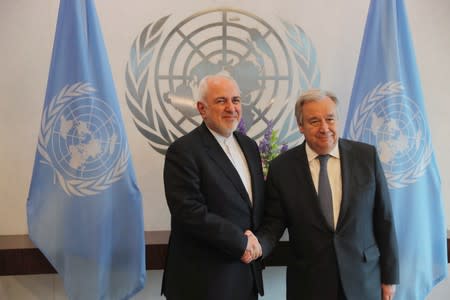 Iranian Foreign Minister Javad Zarif greets United Nations (U.N.) Secretary-General Antonio Guterres at U.N. Headquarters in the Manhattan borough of New York