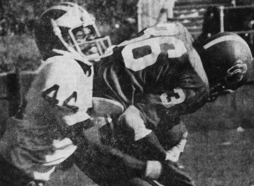 Jim (JJ) Jennings, Rutgers’ premier running back, welcomes Steve Schwartz back to NJ. Schwartz (44) from Long Branch, tries to contain Jennings in the third period, but the Knights did the job against Delaware, snapping the Hens 20-game winning streak on Saturday, Oct. 20, 1973.