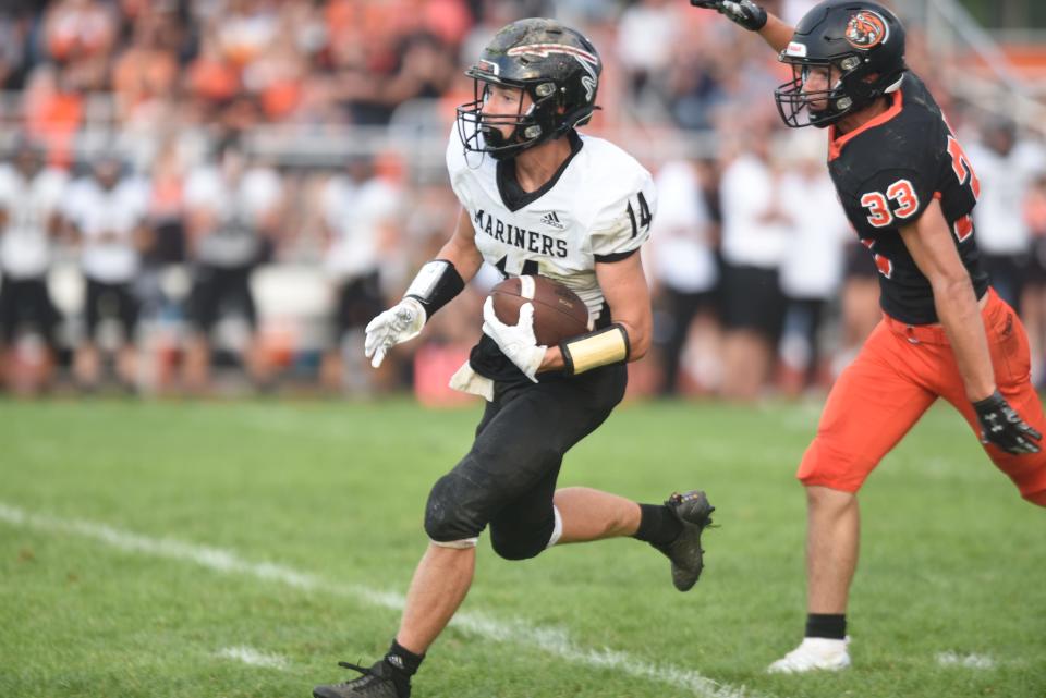 Marine City's Parker Atkinson runs after a catch during a game earlier this season.