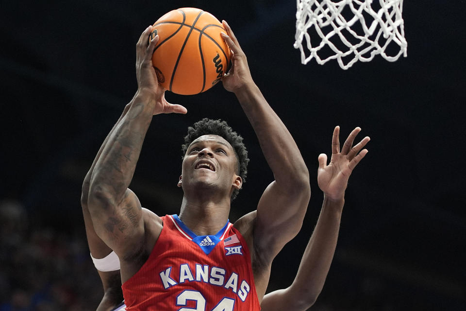 Kansas forward K.J. Adams Jr. (24) shoots during the first half of an NCAA college basketball game against Kansas State Tuesday, March 5, 2024, in Lawrence, Kan. (AP Photo/Charlie Riedel)