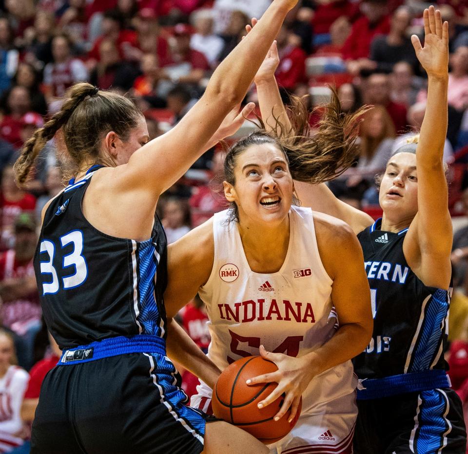 Indiana's Mackenzie Holmes (54) drives past past Eastern Illinois' Macy McGlone (33) and Alana Vinson (11) during the first half of the Indiana versus Eastern Illinois women's basketball game at Simon Skjodt Assembly Hall on Thursday, Nov. 9, 2023.