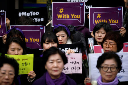 Women attend a protest as a part of the #MeToo movement on International Women's Day in Seoul, South Korea, March 8, 2018. REUTERS/Kim Hong-Ji
