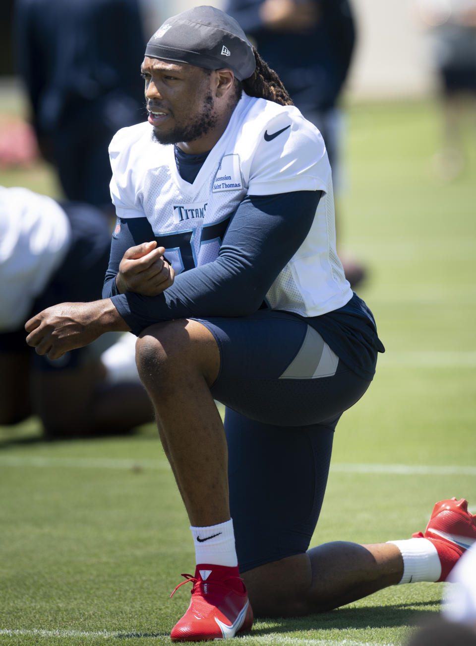 Tennessee Titans running back Derrick Henry stretches during an NFL football minicamp practice Tuesday, June 15, 2021, in Nashville, Tenn. (George Walker IV/The Tennessean via AP, Pool)