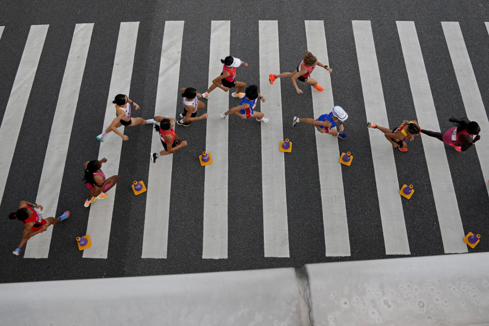 Runners compete during the women's marathon at the 19th Asian Games in Hangzhou, China, Thursday, Oct. 5, 2023. (AP Photo/Aijaz Rahi)