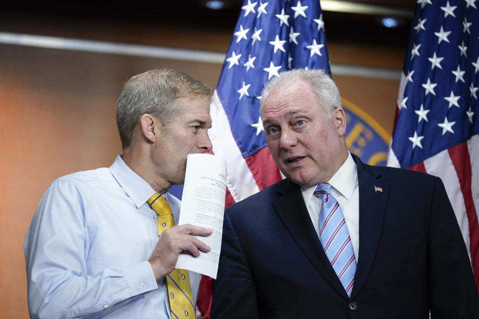 Rep. Jim Jordan, R-Ohio, left, the ranking member on the House Judiciary Committee, confers with House Minority Whip Steve Scalise, R-La., as Republican members of the House Second Amendment Caucus meet with reporters as they criticize a series of Democratic measures to curb gun violence in the wake of the mass shootings at a school in Uvalde, Texas, and a grocery in Buffalo, N.Y., at the Capitol in Washington, Wednesday, June 8, 2022. (AP Photo/J. Scott Applewhite)