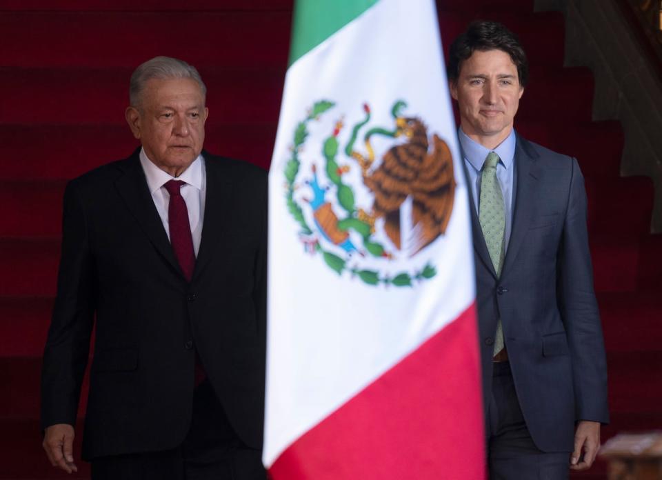 Prime Minister Justin Trudeau and Mexican President Andres Manuel Lopez Obrador make their way to a signing ceremony at the National Palace in Mexico City, Mexico on Wednesday Jan. 11, 2023. (Adrian Wyld/The Canadian Press - image credit)