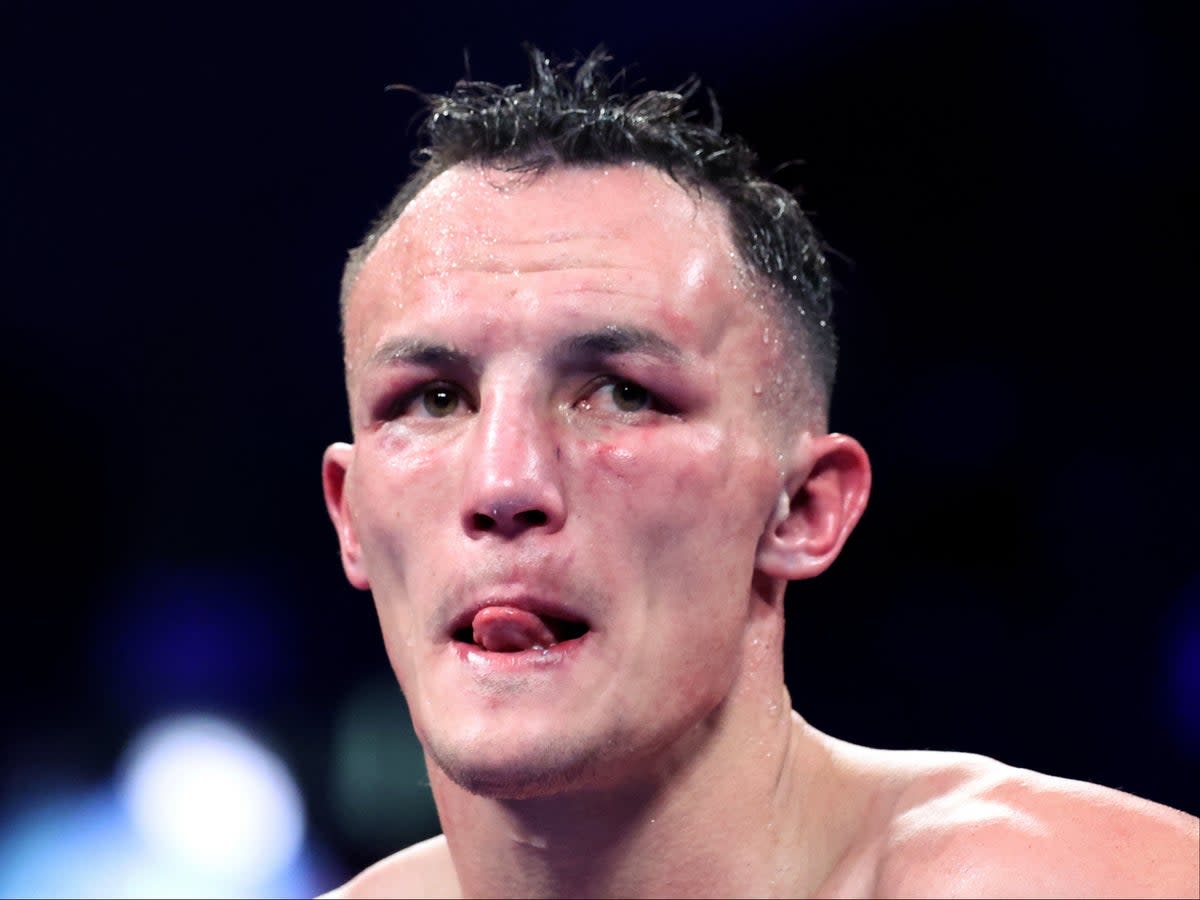 A beaten Josh Warrington reacts as his hometown crowd falls silent in Leeds (Getty Images)