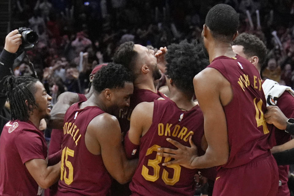 Cleveland Cavaliers guard Max Strus, center, celebrates with teammates after hitting the game-winning basket against the Dallas Mavericks in an NBA basketball game Tuesday, Feb. 27, 2024, in Cleveland. (AP Photo/Sue Ogrocki)