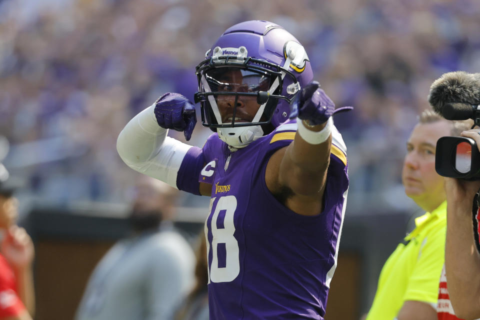 Minnesota Vikings wide receiver Justin Jefferson (18) celebrates after catching a pass for a first down during the first half of an NFL football game against the Los Angeles Chargers, Sunday, Sept. 24, 2023, in Minneapolis. (AP Photo/Bruce Kluckhohn)