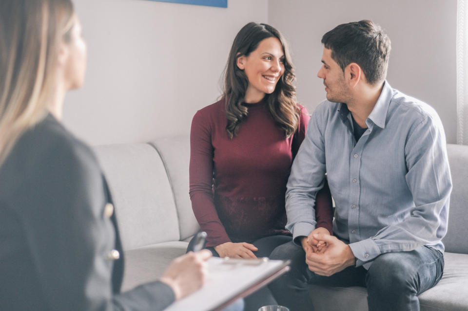 A happy couple in counseling appointment