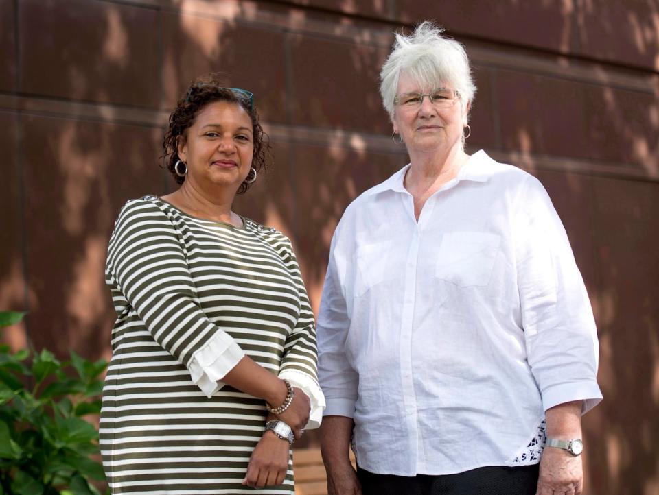 Councillors Bernadette Clement, left, and Elaine MacDonald are shown outside Cornwall's Nav Centre, which is temporarily housing U.S. asylum seekers, on Wednesday, Aug. 23, 2017. THE CANADIAN PRESS/Justin Tang