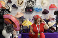 Cher Green-Hawt tries on a hat at the Breeders' Cup horse races at Santa Anita Park, Saturday, Nov. 2, 2019, in Arcadia, Calif. (AP Photo/Gregory Bull)