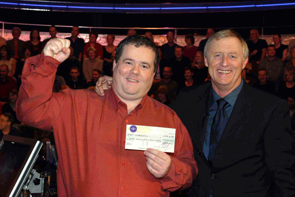 Computer programmer and fearsome quizzer Pat Gibson celebrates his win in 2004. (PA)