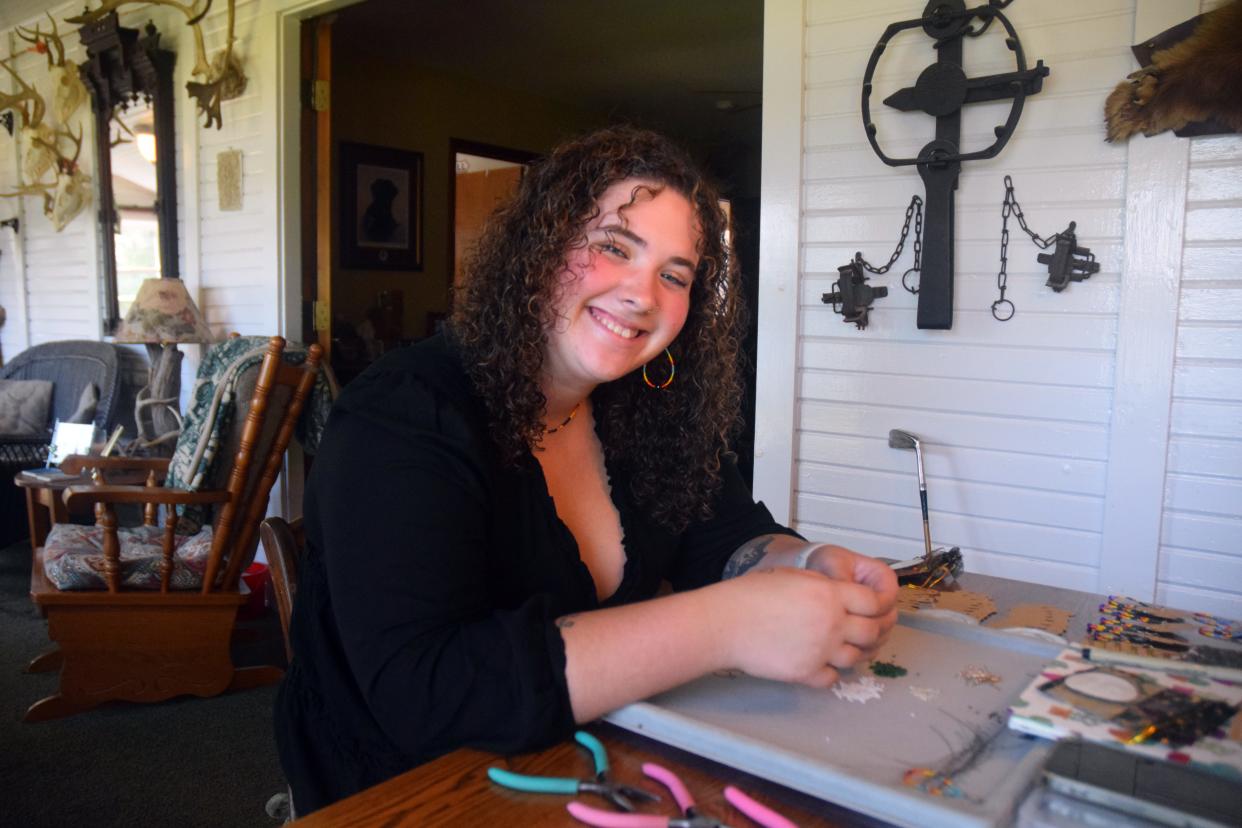 Alia Wright, owner of Bea's Beads, poses for a photo while working on beaded jewelry at her home in Hamburg Township on Wednesday, Sept. 20.