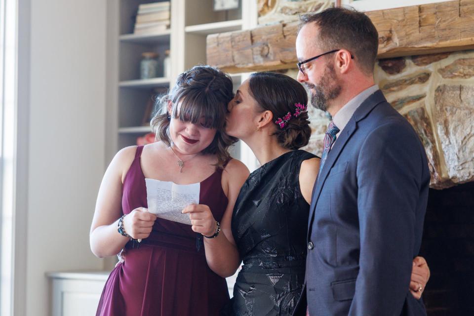 Amy Milrose kisses her daughter, Charlotte Gerhart, during a surprise wedding ceremony, Friday, March 29, 2024, at Wynridge Farms in York Township.