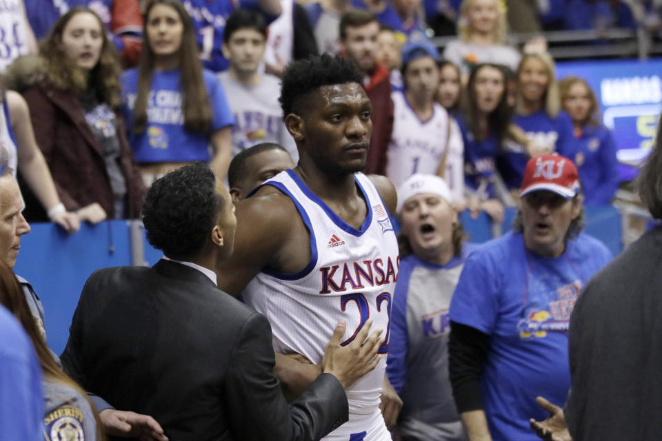 Kansas forward Silvio De Sousa (22) walks out of the crowd after a brawl during the second half of an NCAA college basketball game against Kansas State in Lawrence, Kan., Tuesday, Jan. 21, 2020. Kansas defeated Kansas State 81-59. (AP Photo/Orlin Wagner)