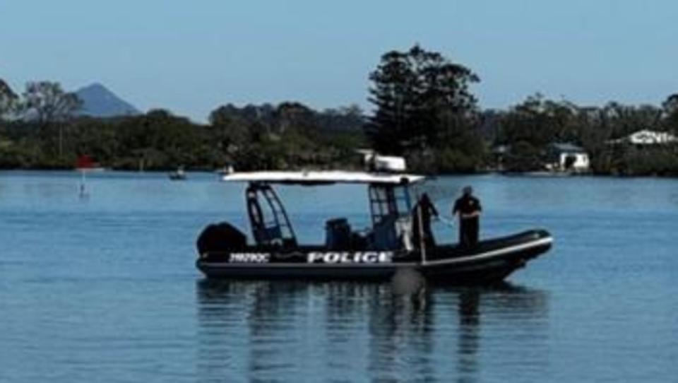 Police were assisted by firefighters and paramedics in retrieving the body. Picture: Seven ,A body has been found floating on the Maroochy River on Queensland's Sunshine Coast. Picture: Seven