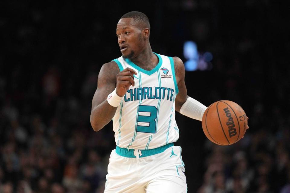 Charlotte Hornets guard Terry Rozier (3) dribbles against the Phoenix Suns during the first half at Footprint Center.