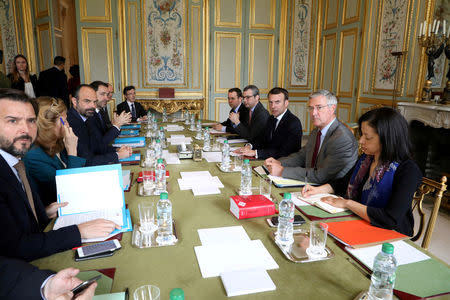 French President Emmanuel Macron flanked by his cabinet director Patrick Strzoda and Elysee general secretary Alexis Kohler holds a meeting with Prime Minister's cabinet director Benoit Ribadeau-Dumas, Justice Minister Nicole Belloubet, Prime Minister Edouard Philippe, Interior Minister Christophe Castaner and Interior Junior Minister Laurent Nunez at the Elysee Palace in Paris, France March 18, 2019. Ludovic Marin/Pool via REUTERS