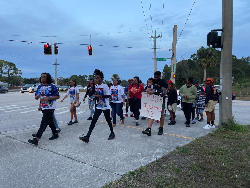 A crowd of about 40 gathered to walk with signs in honor of the two teens killed at Palm Bay's "The Compound" on Christmas 2022. Afterward, a group of about 80 attended the Palm Bay City Council meeting to speak on regulating the compound and for combatting gun violence.